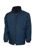 A Uneek UC606 childrens unisex classic reversable fleece jacket in Navy