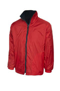 A Uneek UC606 childrens unisex classic reversable fleece jacket in Red/Navy