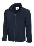 A Uneek UC611 adult unisex deluxe soft shell jacket in Navy