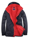 A Uneek UC621 Deluxe Outdoor Jacket in Navy & Red on a white background