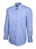 A mid blue Uneek UC701 button-up shirt with long sleeves and a collar, displayed on a plain background.