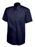 UC702 Navy button-up short-sleeved shirt by Uneek displayed on a white background, featuring a pointed collar and a left chest pocket.