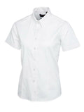 A white short-sleeved Uneek UC704 button-up shirt displayed on a white background.