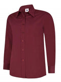 A burgundy UC711 button-down dress shirt displayed on a white background, featuring a pointed collar and long sleeves.