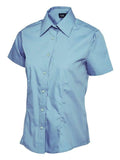 A light blue, button-up shirt with short sleeves and a pointed collar from Uneek (UC712), displayed on a plain white background.