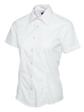 A white, button-up shirt with short sleeves and a pointed collar from Uneek (UC712), displayed on a plain white background.