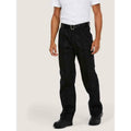 A man wearing a UC901 Black Uneek workwear trousers