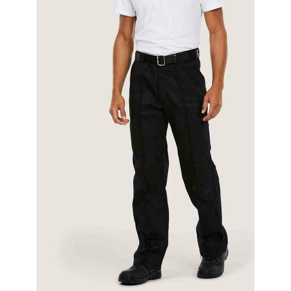 A man wearing a UC901 Black Uneek workwear trousers
