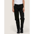 A woman wearing a UC905 Black Uneek ladies cargo trousers