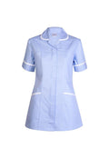 A Uneek short-sleeve ladies scrub tunic in sky blue with white trim on collar, sleeves, and pockets, displayed on a white background.