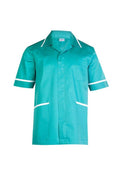 A Uneek UC924 mens heavyweight emerald short-sleeve beauty and spa tunic with white trim around the collar and arms. It features a front button closure, a cross over neckline, and two front pockets outlined in white.