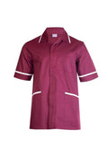 A Uneek UC924 mens heavyweight maroon short-sleeve beauty and spa tunic with white trim around the collar and arms. It features a front button closure, a cross over neckline, and two front pockets outlined in white.