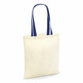 A Westford Mill W101C beige tote bag featuring long blue handles, displayed in an upright position.