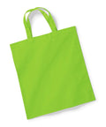 A sleek tote bag from Westford Mill, product W101S, showcased in a vibrant green color against a white background. The fabric-made bag comes with two handles and is displayed empty, lying flat with a pristine, smooth surface.