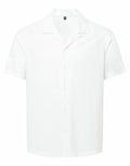 The Wombat WB500, a plain white short-sleeve button-up shirt featuring a relaxed collar, is displayed against a plain background.