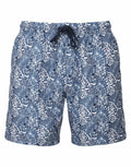 The Wombat WB900 swim trunks, featuring a tropical leaf pattern, come in blue and white with a drawstring waistband.