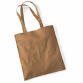 The WM101 by Westford Mill is a simple design brown fabric tote bag with two handles, shown lying flat on a white background.