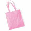 A plain pink tote bag with two handles, laid flat against a white background. The bag is simple in design, featuring no visible logos or patterns. It is the WM101 model by Westford Mill.