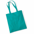 A plain turquoise tote bag from Westford Mill, product code WM101, with two handles lies flat against a white background.