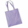 A Westford Mill tote bag, model WM101, is displayed against a plain white background. The bag features a simple design with two handles and comes in a lavender hue, crafted from fabric.