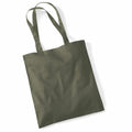 A plain olive green WM101 tote bag by Westford Mill with two handles, resting on a white surface. The fabric looks smooth and unadorned, ideal for casual use or carrying items.