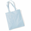 A WM101 tote bag in light blue, featuring two handles, is displayed lying flat on a white background. The brand of the bag is Westford Mill.