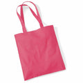 A WM101 tote bag by Westford Mill, featuring a pink fabric design with two long handles, displayed against a white background.