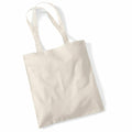 The Westford Mill WM101 is a plain, light beige canvas tote bag featuring two long handles. It is shown against a white background, empty and unadorned, with a simple rectangular shape.