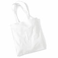 The Westford Mill WM101, a plain white tote bag with two long handles, is lying flat against a white background. The slight creases on the bag add to its realistic appearance.
