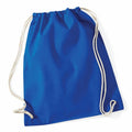 The Westford Mill WM110 bag, featuring blue fabric and white cords, is lying flat with slight natural creases. The drawstrings loop at both the top and bottom corners, and the bag has a simple, solid design without any additional features or patterns.