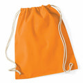 The WM110 by Westford Mill, a vibrant orange drawstring backpack featuring white cords, is positioned against a plain white background. The bag's slightly wrinkled texture and minimalist design highlight its practicality and suitability for casual use.