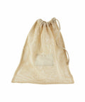 A WM155 beige mesh drawstring bag from Westford Mill, featuring a rectangular fabric patch on the front.