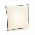 WM355, a square off-white pillow from Westford Mill, features black piping along the edges.