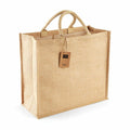 A rectangular jute bag from Westford Mill, model WM408, with two handles and a label attached, standing upright.