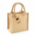 The WM411 by Westford Mill is a jute tote bag featuring short handles and an attached tag with the word "Jute.