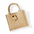 A Westford Mill WM412 jute tote bag featuring sturdy handles and a small tag, displayed on a white background.