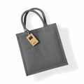 WM413 by Westford Mill is a gray jute tote bag with sturdy handles and a small label attached.