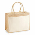 The Westford Mill WM427 is a tote bag with a beige and cream color scheme, featuring sturdy handles and a rectangular structure.