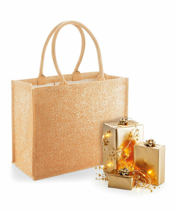 A Westford Mill WM437 is placed next to three gold-wrapped presents adorned with golden beads and small star-shaped ornaments.