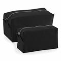 Two black, rectangular toiletry bags with silver zippers from Westford Mill's WM552 series, featuring one larger and one smaller bag, are displayed against a white background.