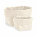 The Westford Mill WM572 set, featuring two beige fabric storage baskets of different sizes, is arranged side by side against a white background.