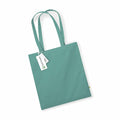 The Westford Mill WM801 tote bag, featuring a turquoise color and two handles, is placed on a white background with a tag attached to one of the handles.