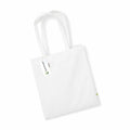 A plain canvas tote bag by Westford Mill (model WM801) featuring long handles, lying flat against a light surface. It includes a small green label on the side and has paper tags attached to one handle.