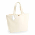 A beige canvas tote bag from Westford Mill, model WM855, featuring a short handle with a small wooden button and an attached tag.