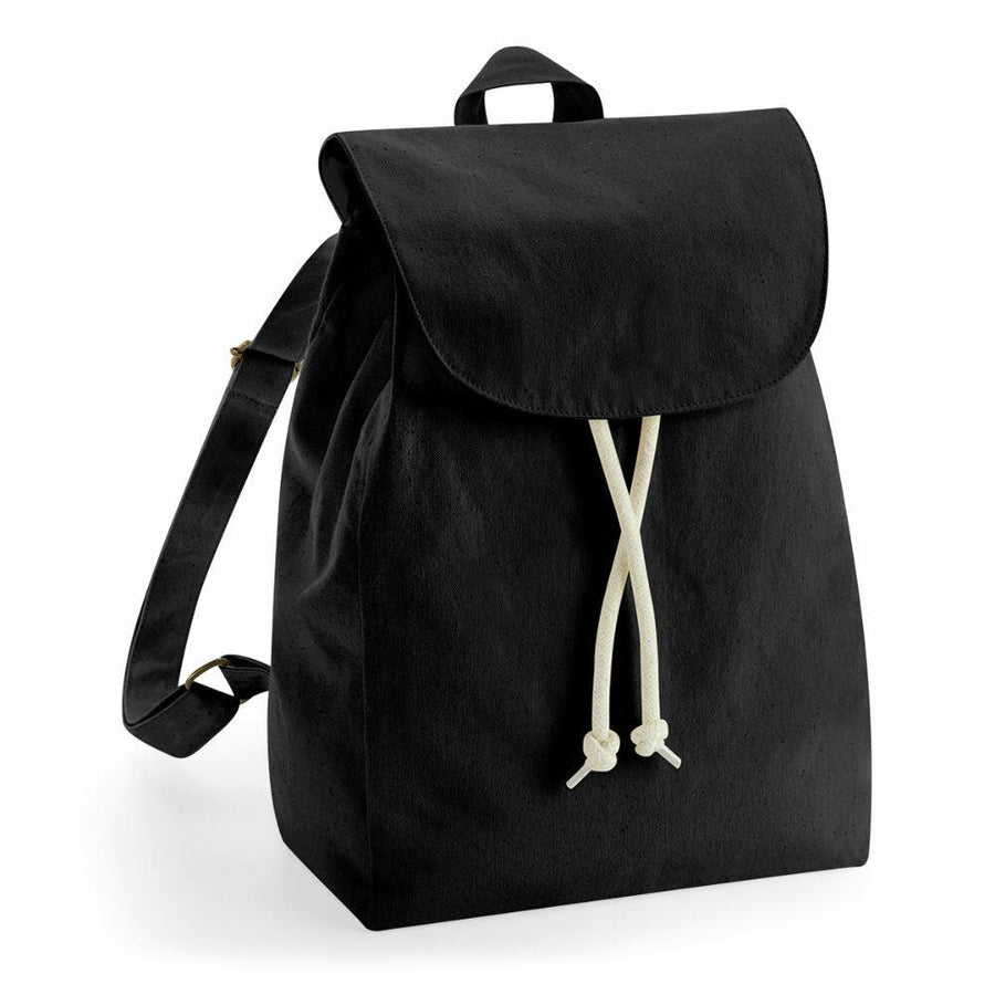 A Westford Mill WM880 black canvas backpack featuring a flap closure and white drawstring cords.