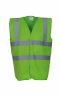 The Yoko YK001, a vibrant green safety vest with silver reflective stripes, is shown against a simple backdrop.