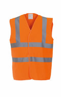 The Yoko YK001 is a sleeveless safety vest in bright orange, featuring reflective silver strips on the front for enhanced visibility. It's designed for high-visibility use in construction or road work environments against a plain white background.