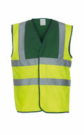 An eye-catching safety vest, YK001 by Yoko, featuring reflective silver stripes set against a vibrant green and yellow background.