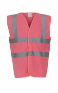 YK001 by Yoko is a bright pink safety vest featuring reflective gray stripes across the chest and shoulders, displayed on a white background.