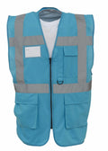 The Yoko YK002 is a blue safety vest with gray reflective stripes, designed with a zippered front and multiple pockets. It is showcased against a plain white background.